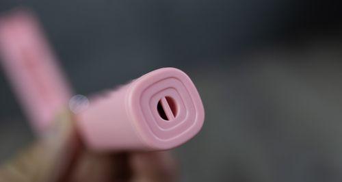 如何用粉色手机支架连接蓝牙拍照？
